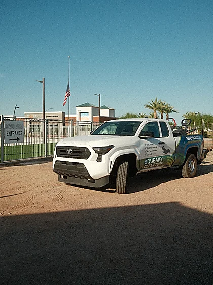 Squeaky Clean Turf service truck parked at the Revel Surf entrance in Mesa, Arizona